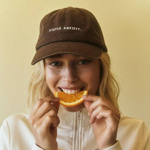 Status Anxiety Under the Sun Cap